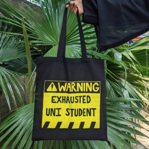 "Warning: Exhausted Uni Student" Black Tote Bag